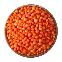 wooden bowl full of red lentils isolated on white