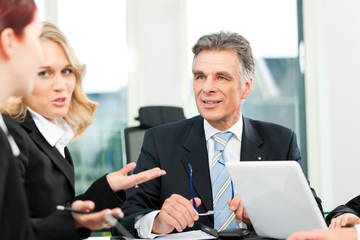 Fototapeta premium Business people - team meeting in an office