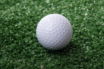 Golf ball ower green grass