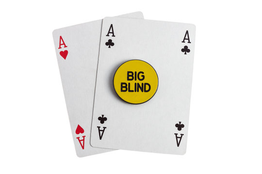 Big blind with two aces casino card over white