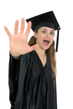 Shocked graduation student woman