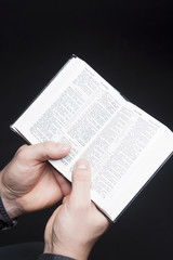 Fototapeta premium bible in hands of man