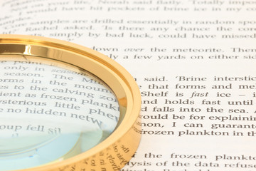 Magnifying glass with book