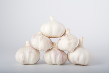 Fresh garlic on grey background