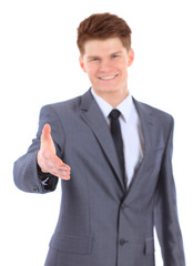 Naklejka premium Confident business man giving you a hand shake