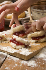 Detail of hands kneading dough