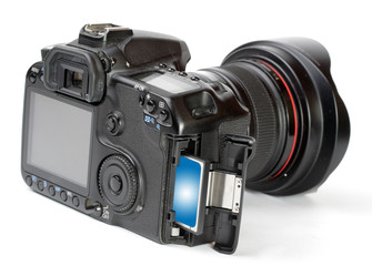 Fototapeta premium Modern digital camera with memory card.