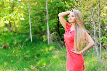 Fototapeta na wymiar Portrait of a beautiful young woman relaxing outdoors