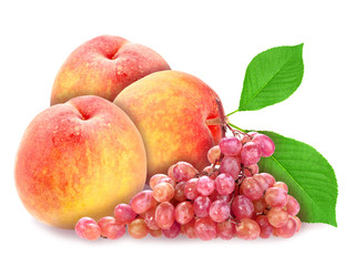 Red grape and peachs with green leaf