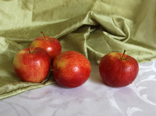 Still life with four apples.