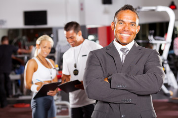 happy smiling male gym manager portrait