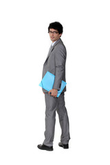 A suave businessman holding a file