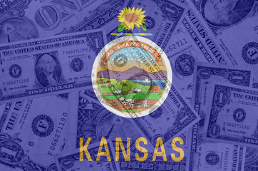 Fototapeta na wymiar US state of kansas flag with transparent dollar banknotes in bac