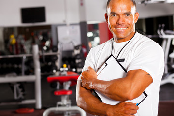 muscular male gym trainer portrait