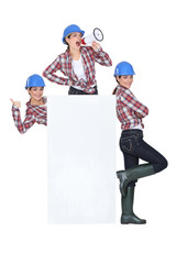 trio of girls wearing blue hard hat