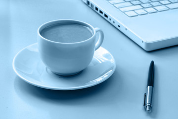 Cup of coffee near press