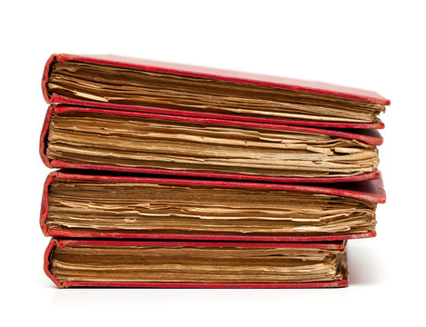stack of old books with red covers
