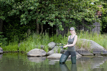 woman fishing in pond