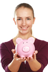 Young beautiful woman with piggy bank