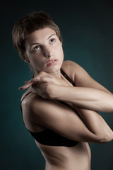 Fototapeta premium young woman in a swimsuit posing in studio