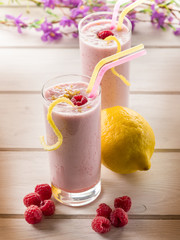 raspberry  milkshake on glass with straw