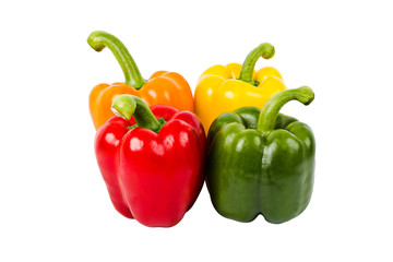 Fresh bell peppers all colors isolated on white background