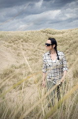 woman walking in sand dunes