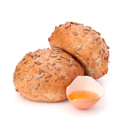 Bun with seeds and broken egg