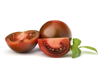 Tomato kumato and basil leaf