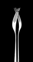 Two crossed silver forks