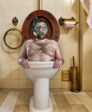 Bizarre man in vintage toilet