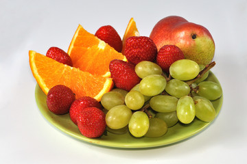 Isolated mix of fruits on plate