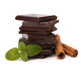 Chocolate bars stack and cinnamon sticks