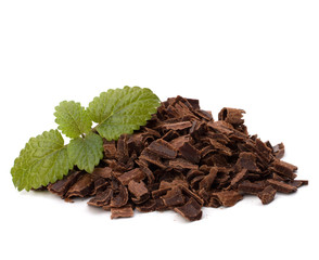 Crushed chocolate shavings pile and mint leaf
