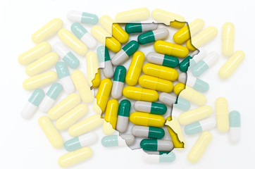 Outline map of sudan with pills in the background for health and
