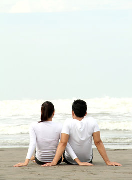 Couple sitting on the beach