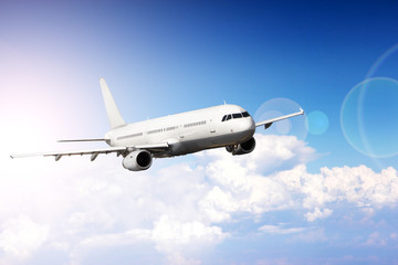 Big jet plane flying above clouds