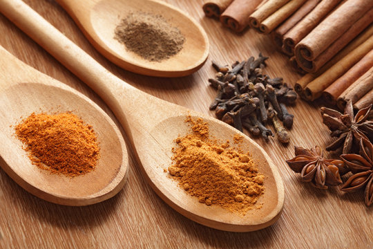 Herbs and Spices over wooden background