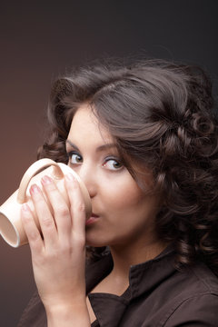 Beauty girl with coffee cup