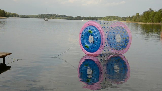plastic zorbing ball on the lake water