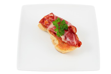 Slice of bread with spine and tomato