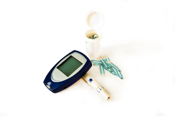 Diabetes testing kit (Glucometer) over a white background