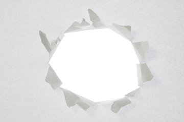 Broken a hole in a sheet of paper