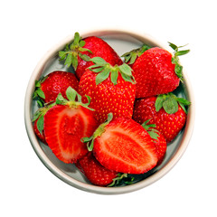 A heap of red fresh strawberries in a dish, isolated on white
