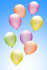 Bunte Luftballons vor Blau