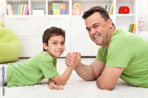 Father And Son Playing Arm Wrestling Stock Photo And