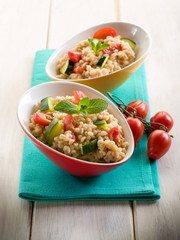 barley risotto with zucchinis and fresh tomatoes