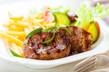 Beefsteaks with French Fries and Salad