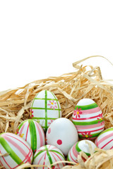 Colored Easter eggs into a nest