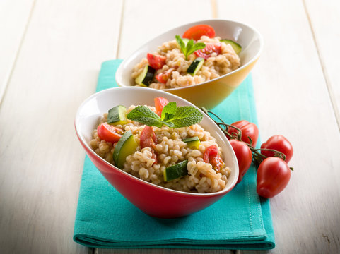 barley risotto with zucchinis and fresh tomatoes
